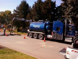 D&L hydrovac truck working on a residential street