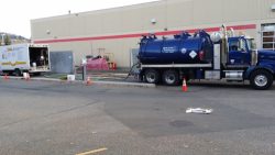 D&L vacuum truck at a commercial building