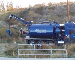 D&L hydrovac crew digging on a roadside slope