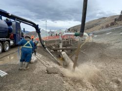 Hydrovac crew excavating around pipeline infrastructure