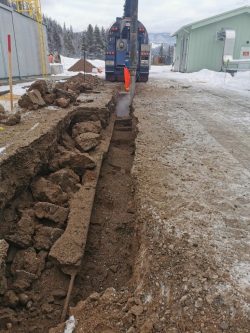 Trench dug by hydro excavation in rocky ground