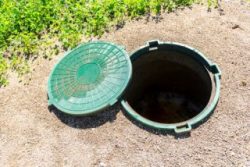 Open septic tank access lid